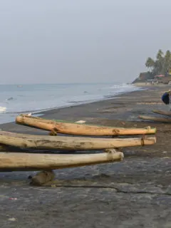 Varkkala split log canoes on the beach