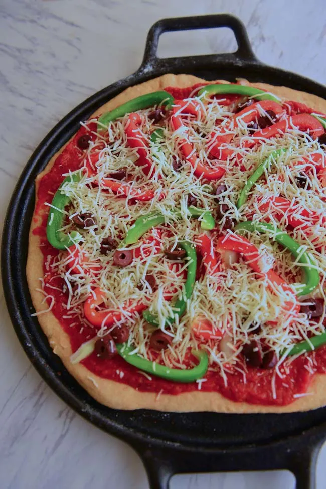 basic whole wheat pizza with your favorite toppings ready to bake