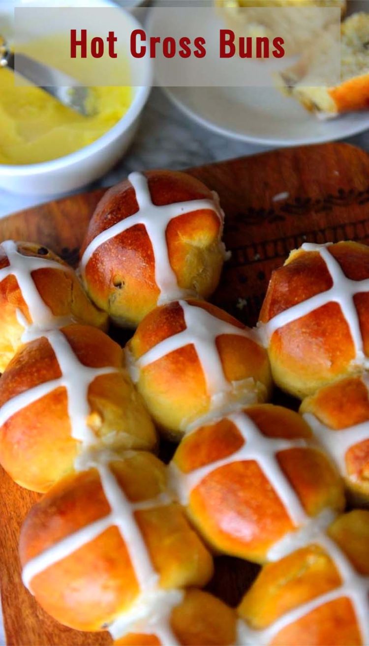 Loaf of hot cross buns and butter.