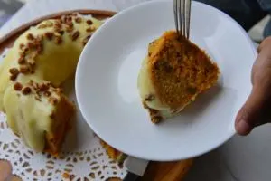A Slice Of Spiced Carrot Cake With Orange Cream Cheese Icing