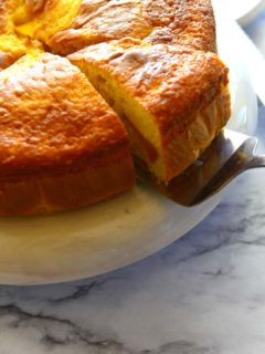 A slice of fresh peach coffee cake made with boxed mix