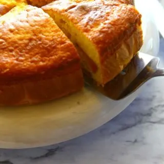 A slice of fresh peach coffee cake made with boxed mix