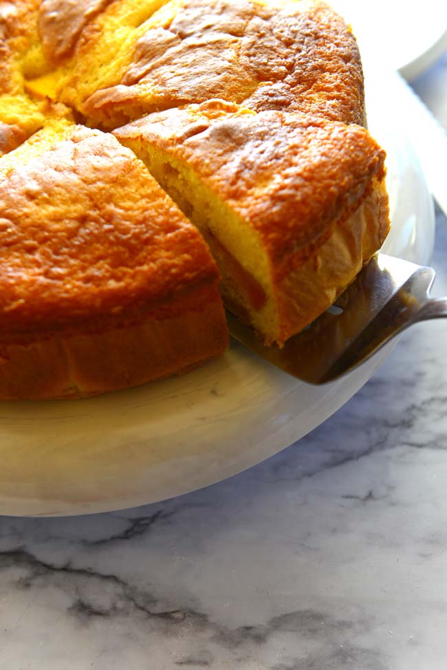 A slice of fresh  peach coffee cake made with boxed mix