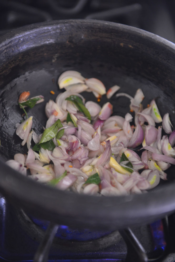 Frying onions for Spicy sardine Curry 