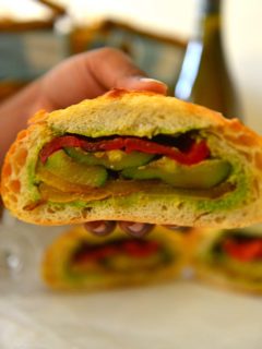 Cross section of a picnic loaf sandwich showing the layers of vegetables.