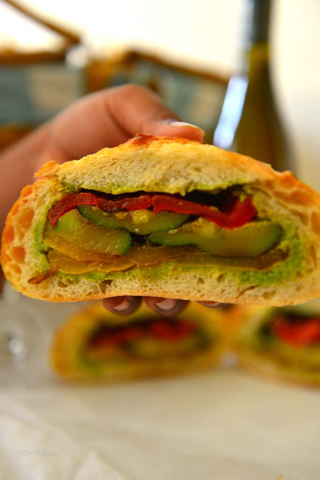 A delicious pressed sandwich with grilled vegetables and a crusty loaf