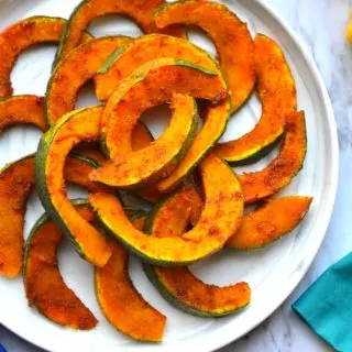 Hot And Sweet Roasted Kabocha squash slices in a white plate
