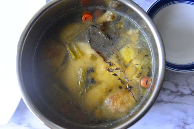 Easy home made chicken stock with the excess fat solidified after refrigerating.