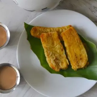 Pazham Pori or Ripe Plantain Fritters served with hot cardamom chai