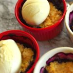 Blueberry cobbler - individual servings in cups with a scoop of icecream on top