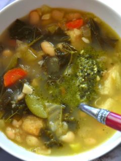 Ribollita is a white bowl with a spoon