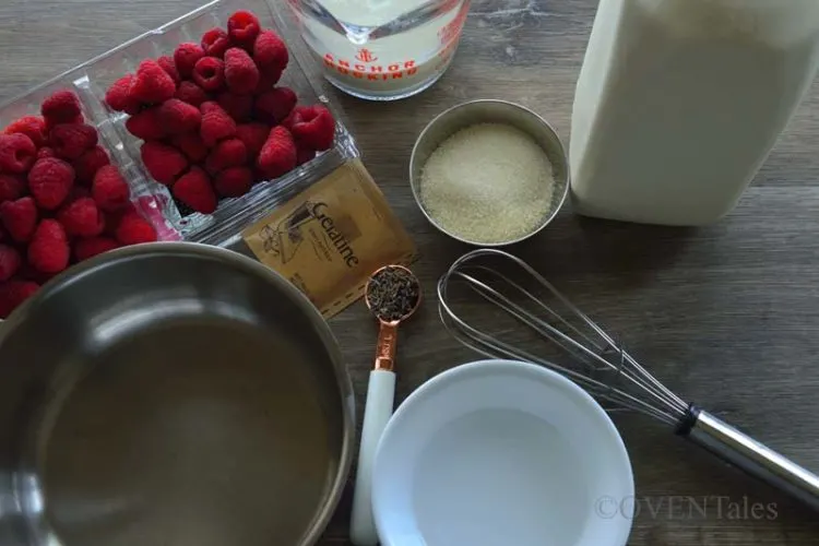 Ingredients for Lavender Panna Cotta - Raspberry, lavender, Milk, Cream, Gelatin, sugar bowl with water, pan and a whish