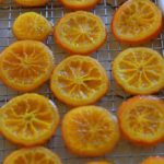 Candied orange slices on the cooling rack.